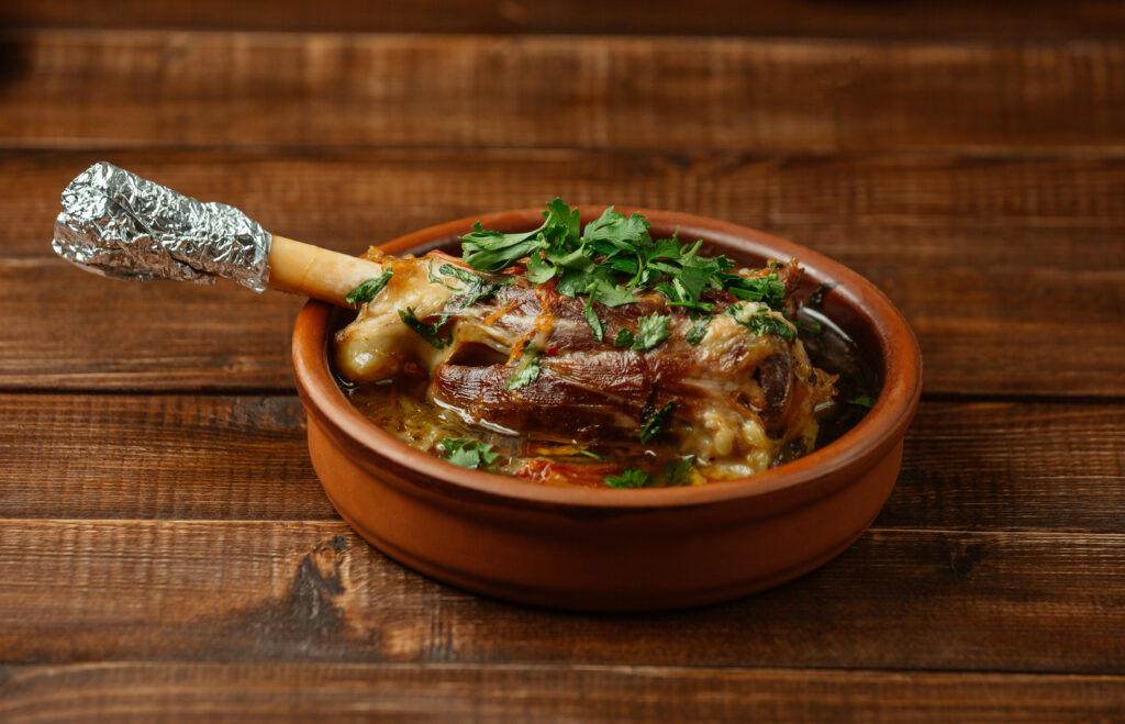 Slow-cooked Lamb Shank Garnished With Fresh Herbs