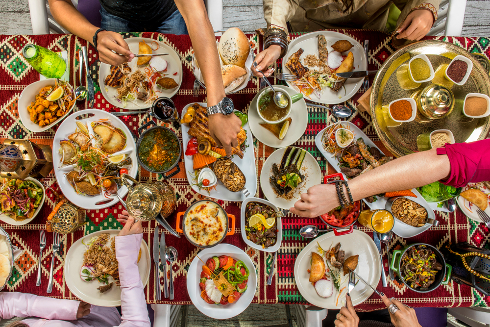 Family Sharing Traditional Lebanese Feast at Table